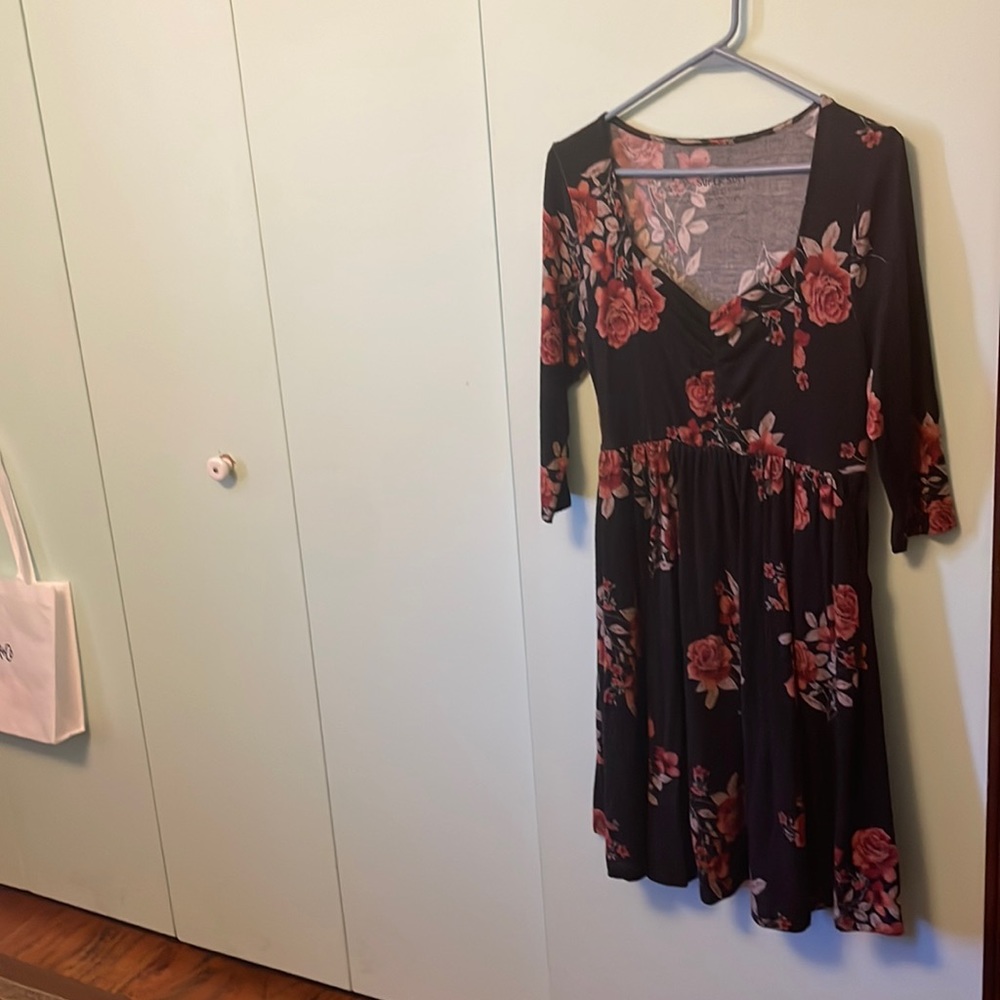 Peplum waist charcoal midi dress with beautiful rose print.Torrid size 0.